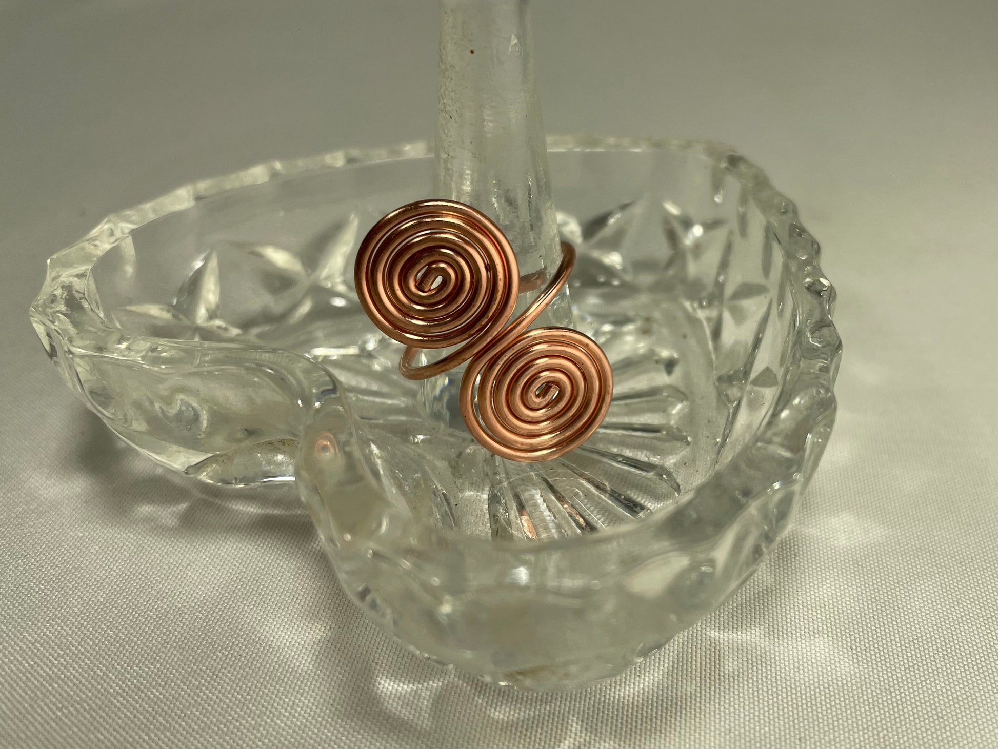 Khaleme Elemental Tensor Ring on heart dish